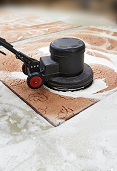 Carpet shampooing service with a rotary brush.